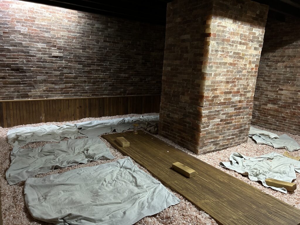 Interior of Club K Seoul, a premium Korean Jjimjilbang in Gangnam, featuring a glowing Himalayan salt room