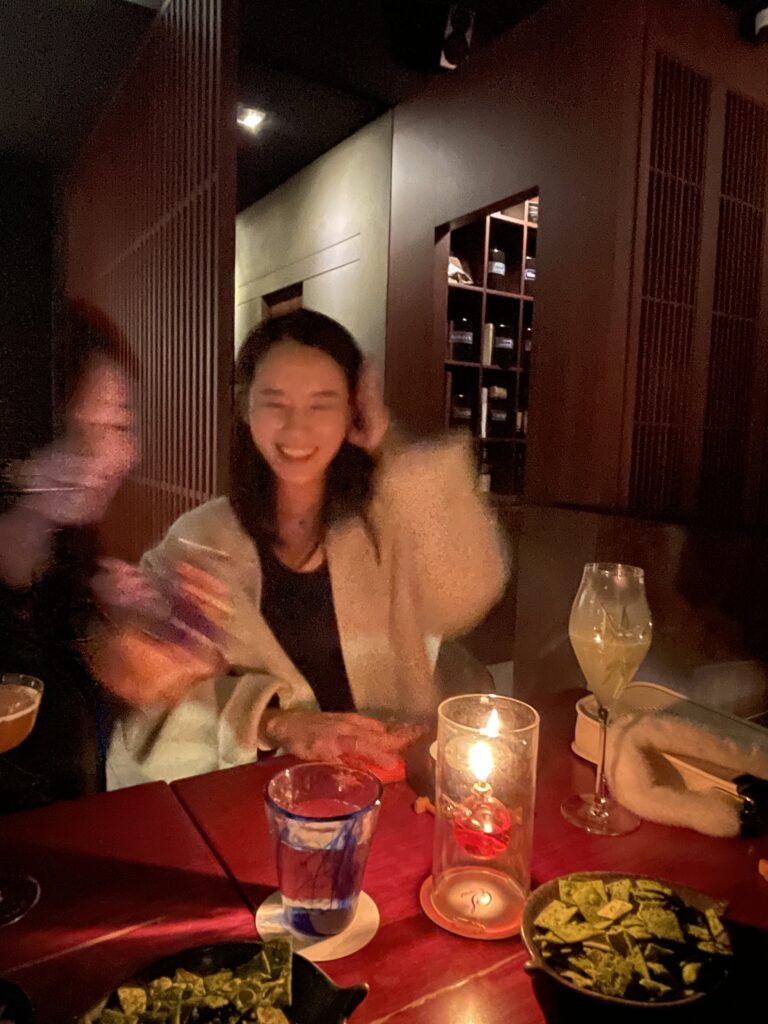 A 7-month pregnant woman enjoying a sophisticated night out with a non-alcoholic mocktail at Bar Tea Scent in Gangnam, Seoul.