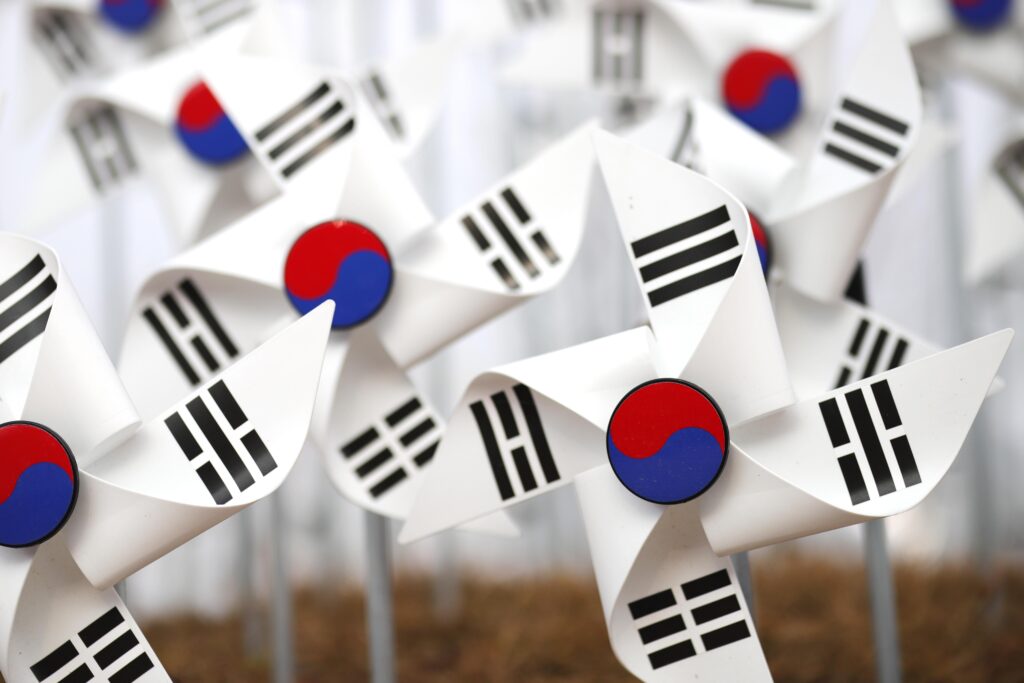 A weathered and faded South Korean national flag, Taegukgi, symbolizing the democratic movement in the film A Taxi Driver.