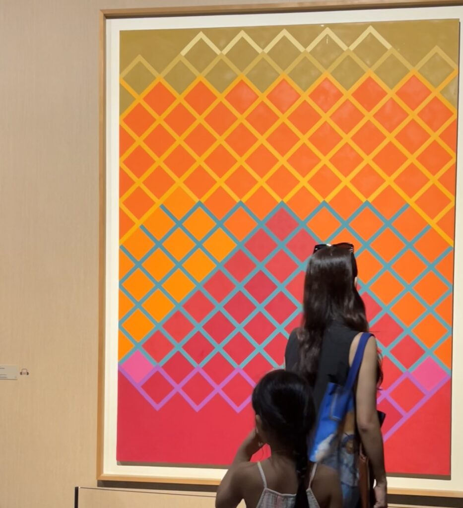A very large painting titled Mountain-Red (1994) by Korean abstract master Yoo Youngkuk. The artwork is dominated by warm, strong red colors and bold lines that simplify the shape of a mountain.