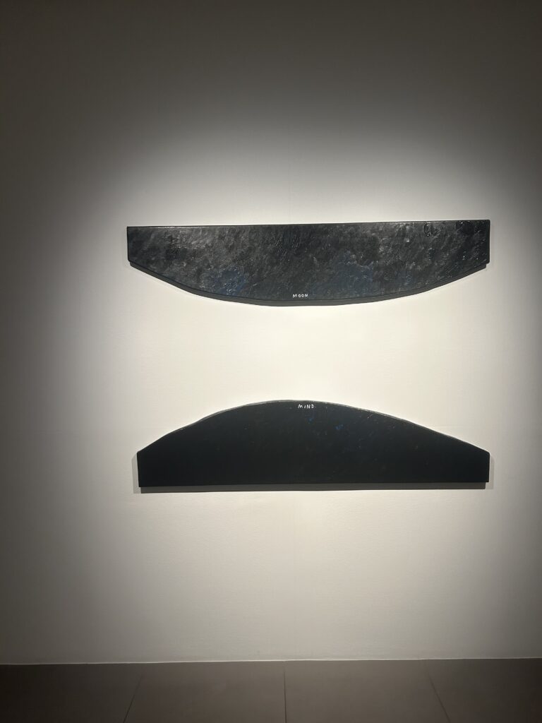 A series of vibrant, shaped-canvas paintings featuring geometric forms and musical notation by artist Christine Sun Kim, displayed in her exhibition Moon Mind at Hyundai Hwarang during Samcheong Night.