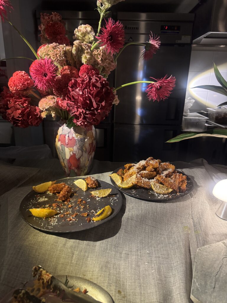 Close-up of catered party snacks, cocktails, and wine glasses set up for guests at a gallery reception during Frieze Seoul 2026 Samcheong Night.